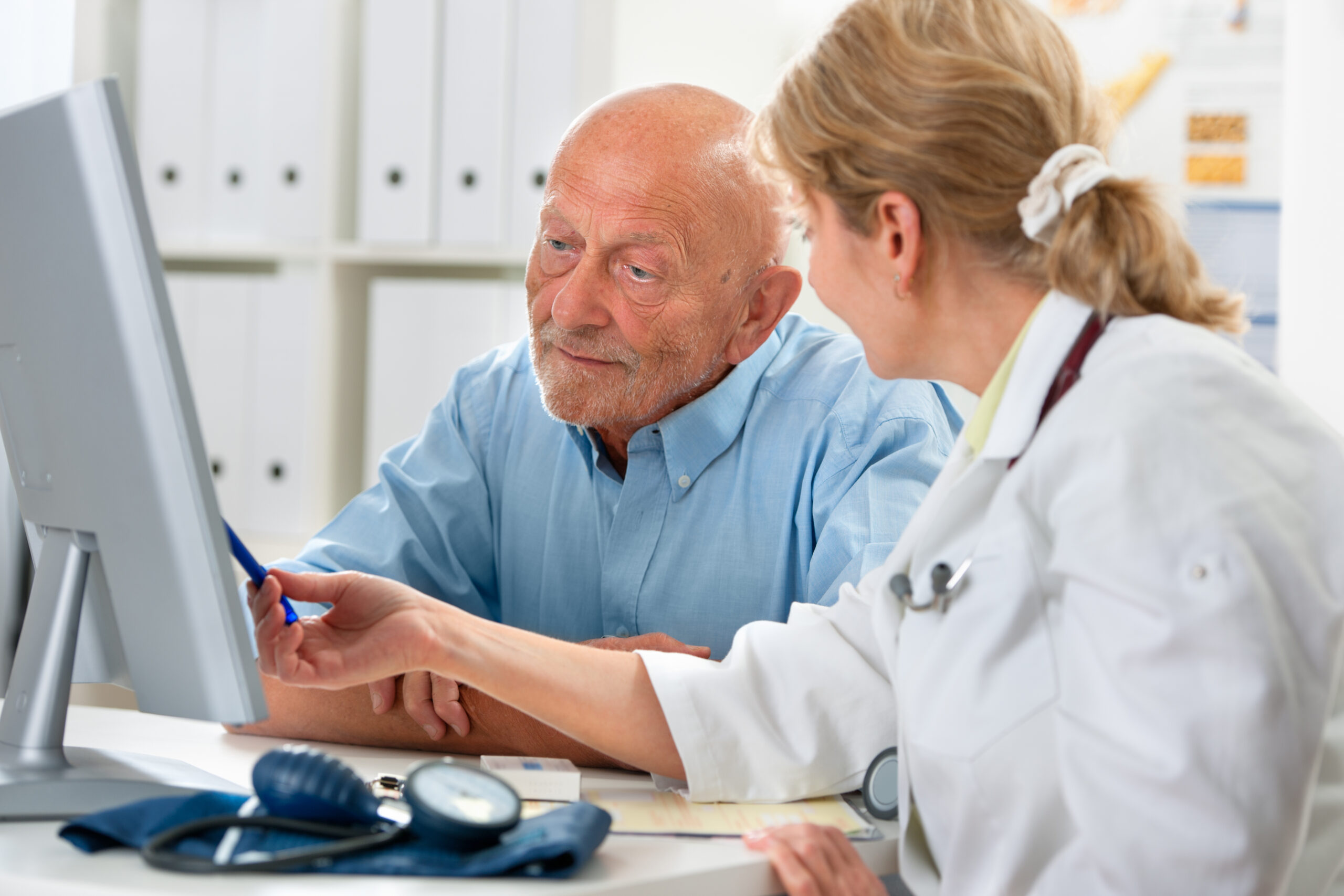 Doctor,Talking,To,Her,Male,Senior,Patient,At,Office